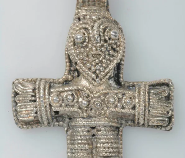 Figurin i form av ett kors